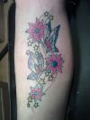 flower with butterfly tat on leg